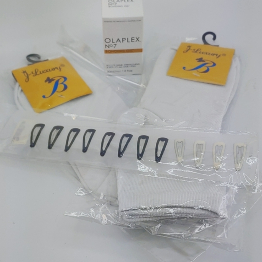Olaplex no. 7 bonding oil with two pair of white socks 12 mini hair clips !